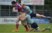 30 April 2017; Jamie McAleese of Clontarf  is tackled by Gavin Mullin of UCD and Colm Mulcahy of UCD during the McCorry Cup Final between UCD and Clontarf at St. Mary's RFC in Dublin. Photo by Sam Barnes/Sportsfile