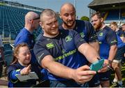 1 May 2017; Leinster's Jack McGrath, left, and Hayden Triggs pose for a photograph with supporter Jennifer Malone, from Clane, in Kildare, during an open squad training session at the RDS Arena, Ballsbridge, Dublin. Photo by Piaras Ó Mídheach/Sportsfile