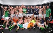 4 November 2011; The Ireland team celebrate, in the dressing room, with the Cormac McAnallen Perpetual Trophy after the International Rules 2nd Test, Australia v Ireland, Metricon Stadium, Gold Coast, Australia. Picture credit: Ray McManus / SPORTSFILE