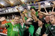 4 November 2011; Steven McDonnell and some Ireland supporters celebrate with the Cormac McAnallen Perpetual Trophy after the game. International Rules 2nd Test, Australia v Ireland, Metricon Stadium, Gold Coast, Australia. Picture credit: Ray McManus / SPORTSFILE