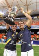 4 November 2011; Pearce and Finian Hanley, Ireland, celebrate with the Cormac McAnallen Perpetual Trophy after the game. International Rules 2nd Test, Australia v Ireland, Metricon Stadium, Gold Coast, Australia. Picture credit: Ray McManus / SPORTSFILE