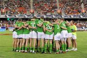 4 November 2011; The Ireland players gather in a huddle and listen to manager Anthony Tohill before the game. International Rules 2nd Test, Australia v Ireland, Metricon Stadium, Gold Coast, Australia. Picture credit: Ray McManus / SPORTSFILE