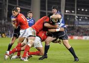 4 November 2011; Mike Ross, Leinster, is tackled by BJ Botha, and Denis Leamy, top, Munster. Celtic League, Leinster v Munster, Aviva Stadium, Lansdowne Road, Dublin. Picture credit: Pat Murphy / SPORTSFILE