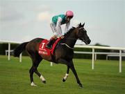 3 September 2011; Famous Name, with Pat Smullen up, canters to the start for The Red Mills Irish Champion Stakes. Horse Racing at Leopardstown, Leopardstown Race Course, Dublin. Picture credit: Ray McManus / SPORTSFILE