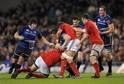 4 November 2011; Cian Healy, Leinster, is tackled by Wian du Preez, left, and Donncha O'Callaghan, Munster. Celtic League, Leinster v Munster, Aviva Stadium, Lansdowne Road, Dublin. Picture credit: Stephen McCarthy / SPORTSFILE