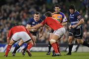 4 November 2011; Cian Healy, Leinster, is tackled by Wian du Preez, left, and Donncha O'Callaghan, Munster. Celtic League, Leinster v Munster, Aviva Stadium, Lansdowne Road, Dublin. Picture credit: Stephen McCarthy / SPORTSFILE
