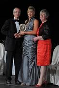 5 November 2011; Waterford's Aisling O'Brien is presented with her 2011 Camogie Soaring Star award by John Treacy, CEO of the Irish Sports Council, Joan O' Flynn, President of the Camogie Association, at the 2011 Camogie All-Stars in association with O’Neills. Citywest Hotel, Saggart, Co. Dublin. Picture credit: Stephen McCarthy / SPORTSFILE