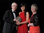 5 November 2011; Waterford's Nicola Morrissey is presented with her 2011 Camogie Soaring Star award by John Treacy, CEO of the Irish Sports Council and Joan O' Flynn, President of the Camogie Association, at the 2011 Camogie All-Stars in association with O’Neills. Citywest Hotel, Saggart, Co. Dublin. Picture credit: Stephen McCarthy / SPORTSFILE