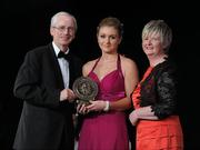 5 November 2011; Meath's Jane Dolan is presented with her 2011 Camogie Soaring Star award by John Treacy, CEO of the Irish Sports Council and Joan O' Flynn, President of the Camogie Association, at the 2011 Camogie All-Stars in association with O’Neills. Citywest Hotel, Saggart, Co. Dublin. Picture credit: Stephen McCarthy / SPORTSFILE