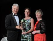 5 November 2011; Antrim's Jane Adams is presented with her 2011 Camogie Intermediate Soaring Star award by Tony Towell, Managing Director of O'Neills, and Joan O' Flynn, President of the Camogie Association, at the 2011 Camogie All-Stars in association with O’Neills. Citywest Hotel, Saggart, Co. Dublin. Picture credit: Stephen McCarthy / SPORTSFILE
