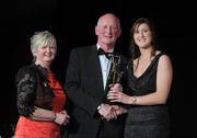 5 November 2011; Wexford's Catherine O'Loughlin is presented with her 2011 Camogie All-Star award by Joan O' Flynn, President of the Camogie Association, and Brian Cody, Kilkenny hurling manager, at the 2011 Camogie All-Stars in association with O’Neills. Citywest Hotel, Saggart, Co. Dublin. Picture credit: Stephen McCarthy / SPORTSFILE