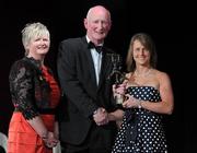 5 November 2011; Tipperary's Jill Horan is presented with her 2011 Camogie All-Star award by Joan O' Flynn, President of the Camogie Association, and Brian Cody, Kilkenny hurling manager, at the 2011 Camogie All-Stars in association with O’Neills. Citywest Hotel, Saggart, Co. Dublin. Picture credit: Stephen McCarthy / SPORTSFILE