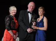 5 November 2011; Wexford's Kate Kelly is presented with her 2011 Camogie All-Star award by Joan O' Flynn, President of the Camogie Association, and Brian Cody, Kilkenny hurling manager, at the 2011 Camogie All-Stars in association with O’Neills. Citywest Hotel, Saggart, Co. Dublin. Picture credit: Stephen McCarthy / SPORTSFILE
