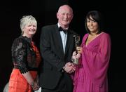 5 November 2011; Wexford's Una Leacy is presented with her 2011 Camogie All-Star award by Joan O' Flynn, President of the Camogie Association, and Brian Cody, Kilkenny hurling manager, at the 2011 Camogie All-Stars in association with O’Neills. Citywest Hotel, Saggart, Co. Dublin. Picture credit: Stephen McCarthy / SPORTSFILE