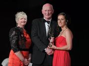 5 November 2011; Cork's Jennifer O'Leary is presented with her 2011 Camogie All-Star award by Joan O' Flynn, President of the Camogie Association, and Brian Cody, Kilkenny hurling manager, at the 2011 Camogie All-Stars in association with O’Neills. Citywest Hotel, Saggart, Co. Dublin. Picture credit: Stephen McCarthy / SPORTSFILE