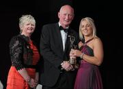 5 November 2011; Wexford's Katrina Parrock is presented with her 2011 Camogie All-Star award by Joan O' Flynn, President of the Camogie Association, and Brian Cody, Kilkenny hurling manager, at the 2011 Camogie All-Stars in association with O’Neills. Citywest Hotel, Saggart, Co. Dublin. Picture credit: Stephen McCarthy / SPORTSFILE