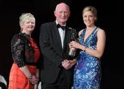 5 November 2011; Galway's Brenda Hanney is presented with her 2011 Camogie All-Star award by Joan O' Flynn, President of the Camogie Association, and Brian Cody, Kilkenny hurling manager, at the 2011 Camogie All-Stars in association with O’Neills. Citywest Hotel, Saggart, Co. Dublin. Picture credit: Stephen McCarthy / SPORTSFILE