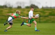 6 May 2017; Diarmuid O'Riordan of Monaghan Town, Co Monaghan, is tagged by Orna Moynahan of Quin-Clooney, Co Clare, whilst competing in U14 and O11 Mixed Tag Rugby during the Aldi Community Games May Festival 2017 at National Sports Campus, in Abbotstown, Dublin.  Photo by Sam Barnes/Sportsfile