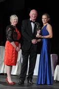5 November 2011; Galway's Therese Maher is presented with her 2011 Camogie All-Star award by Brian Cody, Kilkenny hurling manager, and Joan O' Flynn, President of the Camogie Association, at the 2011 Camogie All-Stars in association with O’Neills. Citywest Hotel, Saggart, Co. Dublin. Picture credit: Stephen McCarthy / SPORTSFILE