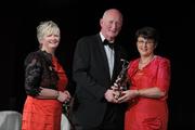5 November 2011; Anne O'Connor, accepting a 2011 Camogie All-Star award on behalf of her daughter Claire O'Connor, Wexford, with Brian Cody, Kilkenny hurling manager, and Joan O' Flynn, President of the Camogie Association, at the 2011 Camogie All-Stars in association with O’Neills. Citywest Hotel, Saggart, Co. Dublin. Picture credit: Stephen McCarthy / SPORTSFILE