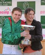 6 November 2011; Jockey Johnny Murtagh is presented with his 2011 Champion Flat Jockey Trophy by Guest of Honour Katie Taylor, World and European Boxing Champion. Leopardstown - 2011 Flat Season Finale Day, Leopardstown Racecourse, Dublin. Picture credit: Stephen McCarthy / SPORTSFILE