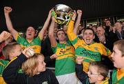 6 November 2011; Gort captain Andy Coen, centre, lifts the cup with team-mates Ollie Fahy, left, and Peter Cummins after victory over Clarinbridge. Galway County Senior Hurling Championship Final, Gort v Clarinbridge, Pearse Stadium, Galway. Picture credit: Diarmuid Greene / SPORTSFILE