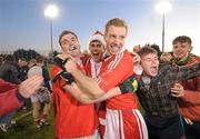 6 November 2011; St. Brigid's players Paddy Andrews, left, and Graham Norton, celebrate with fans after the game. Dublin County Senior Football Championship Final, St Oliver Plunkett's Eoghan Rua v St Brigid's, Parnell Park, Dublin. Photo by Sportsfile