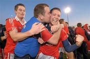 6 November 2011; St. Brigid's players Mark Cahill, left, and Alan Daly, celebrate with manager Mark Byrne after the game . Dublin County Senior Football Championship Final, St Oliver Plunkett's Eoghan Rua v St Brigid's, Parnell Park, Dublin. Photo by Sportsfile