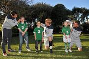 7 November 2011; Three, Sean St. Ledger, Simon Cox and Paul McShane, with children, left to right, Jade Pakenham, age 11, Bobby Pakenham, age 6, and Emma Hayes, age 5, all from Dublin, are asking Irish fans to  'Go Green With Pride' to show their support for the crucial EURO playoffs against Estonia on November 11th and 15th. Three will be providing face painters at the home leg to paint fans' faces green and placing 50K green cards for fans to hold up at the match on every chair in the Aviva Stadium on the 15th. Supporters can also still trade in their old Republic of Ireland football jerseys in any Champion Sports store nationwide and get €20 off the new home jersey. The traded in jerseys will be donated to Friends In Ireland, a charity founded by Marian Finucane that Sean St. Ledger is an ambassador with. The scheme has been extended to run until November 20th. Portmarnock Hotel and Golf Links, Portmarnock, Co. Dublin. Picture credit: David Maher / SPORTSFILE
