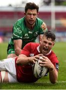 6 May 2017; Conor Oliver of Munster scores his side's seventh try despite the tackle of Danie Poolman of Connacht  during the Guinness PRO12 Round 22 match between Munster and Connacht at Thomond Park, in Limerick. Photo by Brendan Moran/Sportsfile