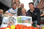 8 November 2011; Pat Gilroy, Éamon Fennell and Michael Darragh McAuley, left, on Dublin’s Moore Street today with street trader Rosie Farrell to promote the official Dublin photography book, A Rare Auld Season. The book, which is supported by official team sponsor Vodafone, charts the success of the Dublin senior football team as they went in search of Sam. A Rare Auld Season has an RRP of €19.95, is produced by Irish sports photography agency Sportsfile and is on sale at www.sportsfile.com and from selected bookshops nationwide. Proceeds from the sale of A Rare Auld Season go towards the Dublin senior football team training and holiday fund. Moore Street, Dublin. Picture credit: Brian Lawless / SPORTSFILE