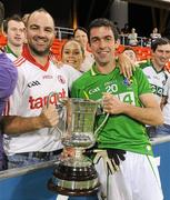 4 November 2011; Ireland's Joe McMahon with Hugh McCarney, from Omagh, Co. Tyrone, and the Cormac McAnallen Perpetual Trophy. International Rules 2nd Test, Australia v Ireland, Metricon Stadium, Gold Coast, Australia. Picture credit: Ray McManus / SPORTSFILE
