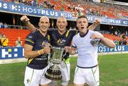 4 November 2011; Tadhg Kennelly, Kieran Donaghy and Tommy Walsh, Ireland, celebrate with the Cormac McAnallen Perpetual Trophy after the game. International Rules 2nd Test, Australia v Ireland, Metricon Stadium, Gold Coast, Australia. Picture credit: Ray McManus / SPORTSFILE