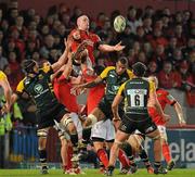 12 November 2011; Paul O'Connell wins possession for Munster, ahead of Mark Sorenson, left, and Courtney Lawes, right, Northampton Saints. Heineken Cup, Pool 1, Round 1, Munster v Northampton Saints, Thomond Park, Limerick. Picture credit: Diarmuid Greene / SPORTSFILE