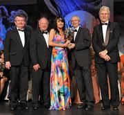 12 November 2011; Tracey Lawlor, Laois, is presented with her All-Star award by John Treacy, Chief Executive of the Irish Sports Council, in the company of, from left, Pol O Gallchoir, Ceannsai, TG4, Pat Quill, President, Ladies Gaelic Football Association, and Tony Towell, Managing Director, O'Neill's, at the O'Neills TG4 Ladies Football All-Star Awards 2011. Citywest Hotel, Saggart, Co. Dublin. Picture credit: Brendan Moran / SPORTSFILE