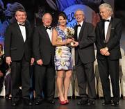 12 November 2011; Briege Corkery, Cork, is presented with her All-Star award by John Treacy, Chief Executive of the Irish Sports Council, in the company of, from left, Pol O Gallchoir, Ceannsai, TG4, Pat Quill, President, Ladies Gaelic Football Association, and Tony Towell, Managing Director, O'Neill's, at the O'Neills TG4 Ladies Football All-Star Awards 2011. Citywest Hotel, Saggart, Co. Dublin. Picture credit: Brendan Moran / SPORTSFILE