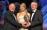 12 November 2011; Laura Rogers, Kerry, is presented with the Munster Young Player of the Year award by John Treacy, Chief Executive of the Irish Sports Council, in the company of Pat Quill, President, Ladies Gaelic Football Association, at the O'Neills TG4 Ladies Football All-Star Awards 2011. Citywest Hotel, Saggart, Co. Dublin. Picture credit: Brendan Moran / SPORTSFILE