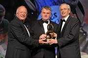 12 November 2011; John Joe Brady, Cavan, is presented with his Hall of Fame award by John Treacy, Chief Executive of the Irish Sports Council, in the company of Pat Quill, President, Ladies Gaelic Football Association, at the O'Neills TG4 Ladies Football All-Star Awards 2011. Citywest Hotel, Saggart, Co. Dublin. Picture credit: Brendan Moran / SPORTSFILE