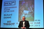 12 November 2011; Dick Dunne, receives the TISSOT PFAI, Overseas Player of the Year Award, on behalf of his son Richard Dunne, Republic of Ireland, at the TISSOT PFAI Player of the Year Awards 2011. Burlington Hotel, Dublin. Picture credit: David Maher / SPORTSFILE
