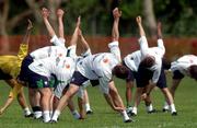 20 May 2002; Players stretch during a Republic of Ireland squad training session at Ada Gym in Susupe, Saipan, Northern Mariana Islands. Photo by David Maher/Sportsfile
