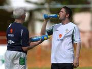 20 May 2002; Robbie Keane takes a drink from team physio Mick Byrne during a Republic of Ireland squad training session at Ada Gym in Susupe, Saipan, Northern Mariana Islands. Photo by David Maher/Sportsfile
