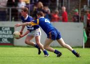6 May 2002; Brian McDonald of Laois in action against Tom Burke of Wicklow during the Bank of Ireland Leinster Senior Football Championship First Round match between Laois and Wicklow at Dr Cullen Park in Carlow. Photo by Brendan Moran/Sportsfile
