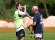 21 May 2002; Kevin Kilbane receives some water from team physio Mick Byrne during a Republic of Ireland squad training session at Ada Gym in Susupe, Saipan, Northern Mariana Islands. Photo by David Maher/Sportsfile