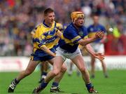 19 May 2002; Eamonn Corcoran of Tipperary in action against James O'Connor of Clare during the Guinness Munster Senior Hurling Championship Quarter-Final match between Tipperary and Clare at Páirc U’ Chaoimh in Cork. Photo by Ray McManus/Sportsfile