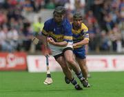 19 May 2002; Donnacha Fahy of Tipperary in action against David Forde of Clare during the Guinness Munster Senior Hurling Championship Quarter-Final match between Tipperary and Clare at Páirc U’ Chaoimh in Cork. Photo by Ray McManus/Sportsfile