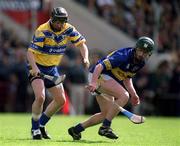 19 May 2002; Conor Clancy of Clare in action against David Kennedy of Tipperary during the Guinness Munster Senior Hurling Championship Quarter-Final match between Tipperary and Clare at Páirc U’ Chaoimh in Cork. Photo by Brendan Moran/Sportsfile