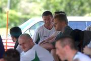22 May 2002; Republic of Ireland captain Roy Keane sits in the shade alongside team-mates following a Republic of Ireland squad training session at Ada Gym in Susupe, Saipan, Northern Mariana Islands. Photo by David Maher/Sportsfile