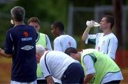 22 May 2002; Republic of Ireland captain Roy Keane, right, takes a break alongside team-mates and manager Mick McCarthy, left, during a Republic of Ireland squad training session at Ada Gym in Susupe, Saipan, Northern Mariana Islands. Photo by David Maher/Sportsfile