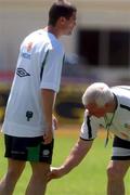 22 May 2002; Republic of Ireland physio attends to Roy Keane during a Republic of Ireland squad training session at Ada Gym in Susupe, Saipan, Northern Mariana Islands. Photo by David Maher/Sportsfile