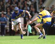 19 May 2002; John O'Brien of Tipperary in action against Sean McMahon of Clare during the Guinness Munster Senior Hurling Championship Quarter-Final match between Tipperary and Clare at Páirc U’ Chaoimh in Cork. Photo by Ray McManus/Sportsfile